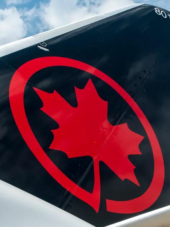 The Air Canada logo on the tailfin of an aircraft