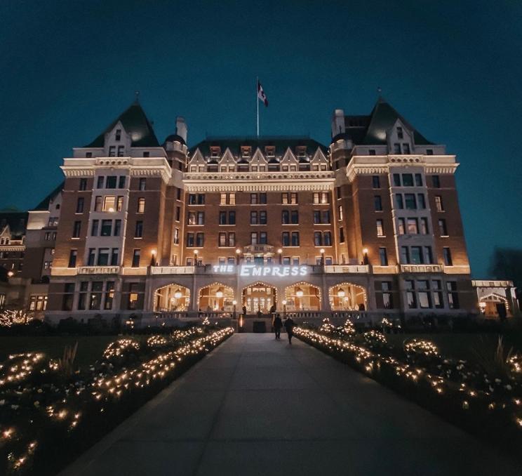 The Fairmont Empress illuminated at night in Victoria, BC