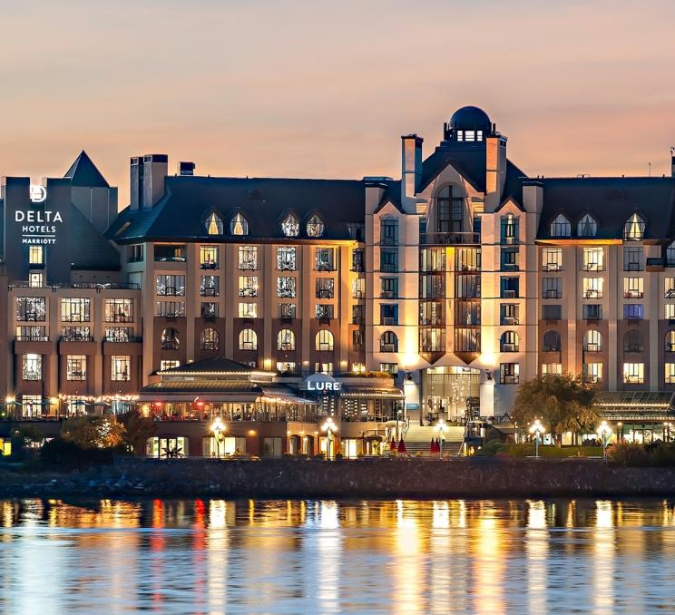 A view of LURE Restaurant & Bar at the Delta Hotels by Marriott Victoria Ocean Pointe Resort in Victoria, BC at sunset