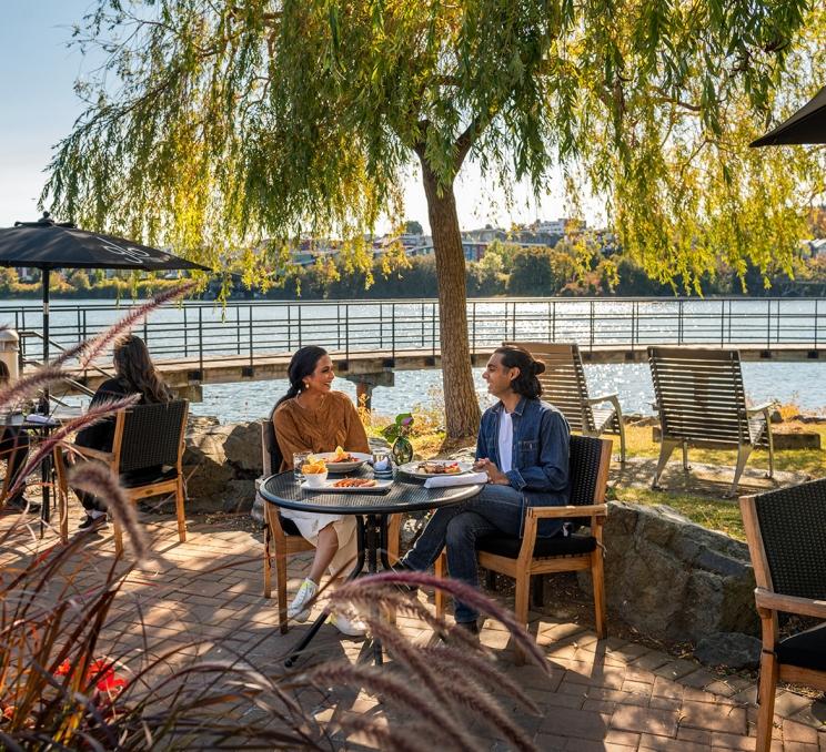 A couple dines on the Patio at Glo Restaurant + Patio in Victoria, BC