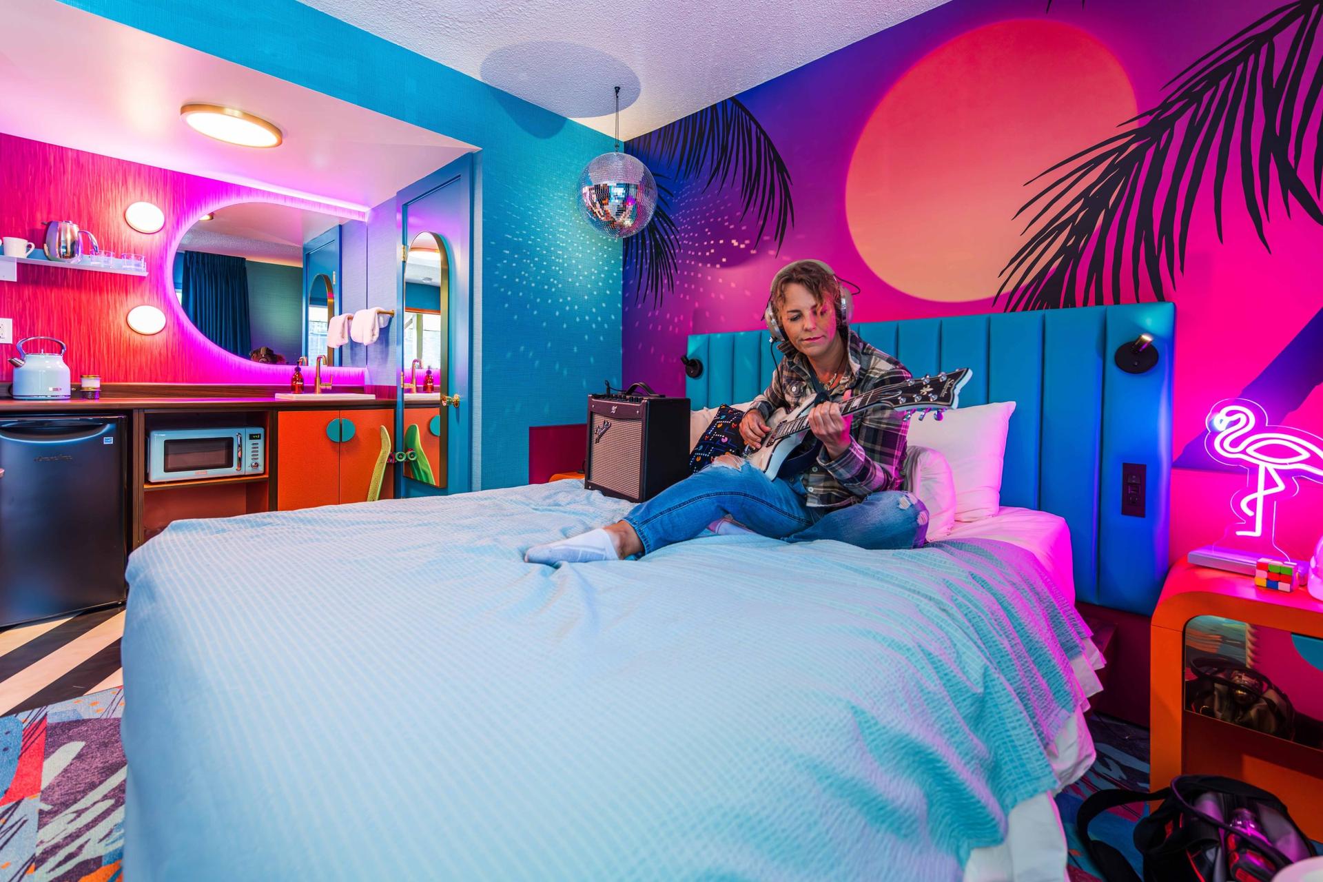 Flying solo? Book our totally rad 80's room complete with disco ball, vintage 80's phone, flamingo lamp and other neon accents...and a rubik's cube to take home!