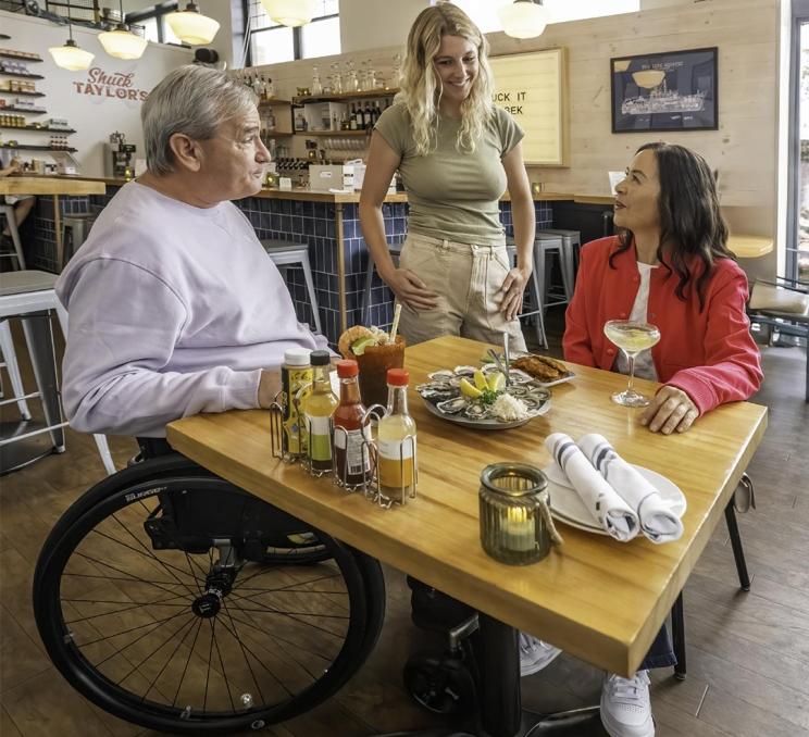 A couple dines at Shuck Taylor's a seafood restaurant in Victoria, BC