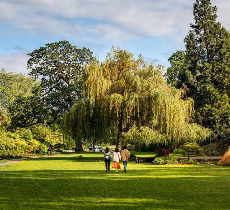 Family walking in Beacon Park, Victoria, BC