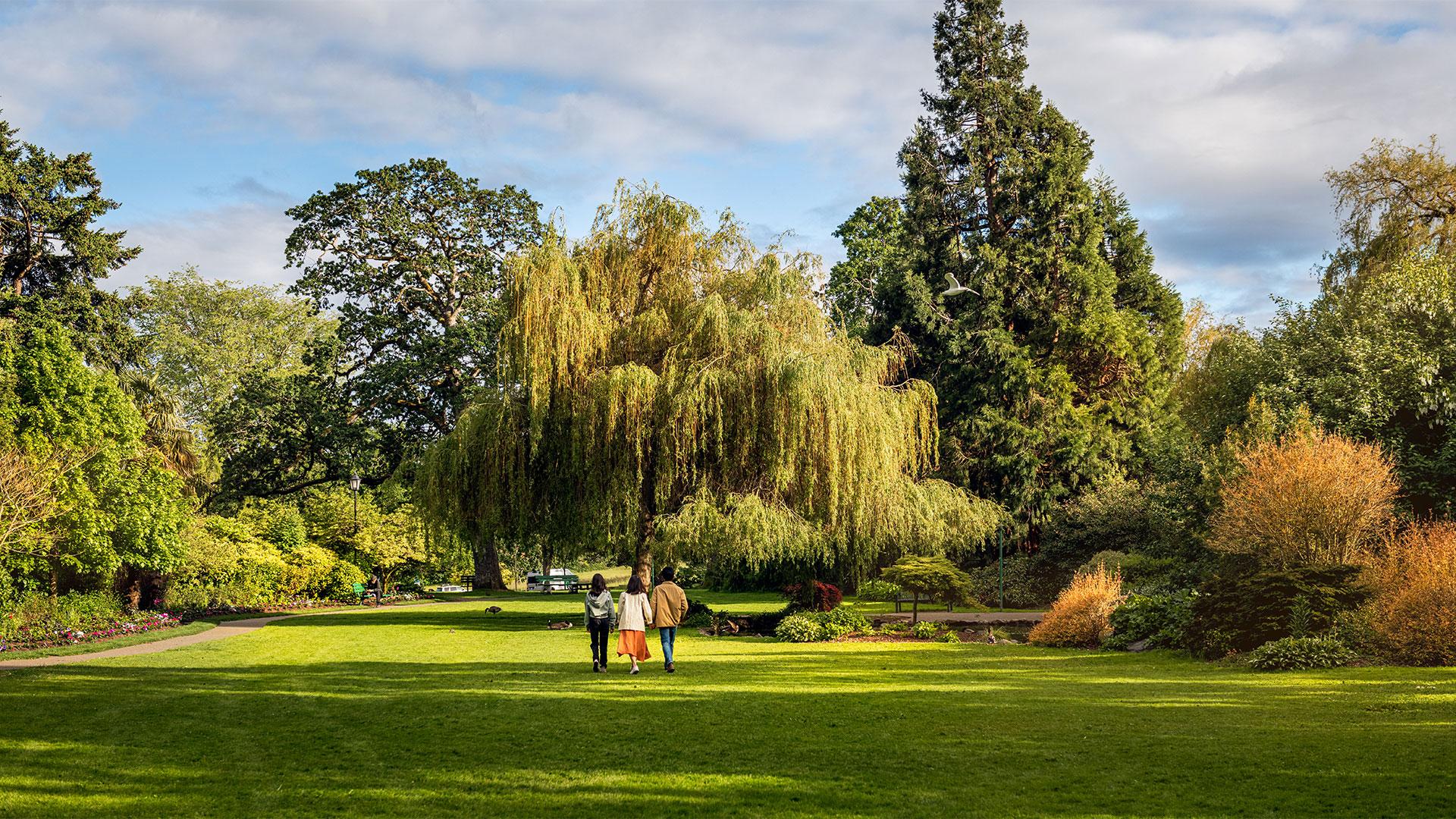 Family walking in Beacon Park, Victoria, BC