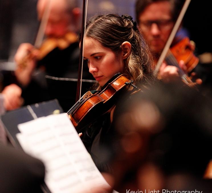 A violinist from the Victoria Symphony plays her violin during an performance in Victoria, BC