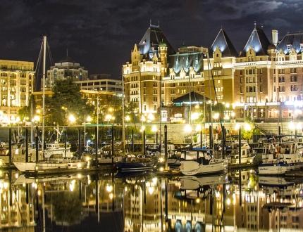 The harbourfront of Victoria, BC illuminated at night