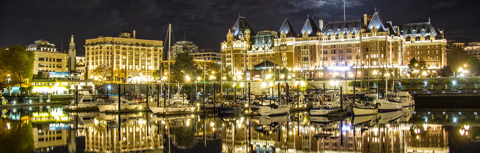 The harbourfront of Victoria, BC illuminated at night
